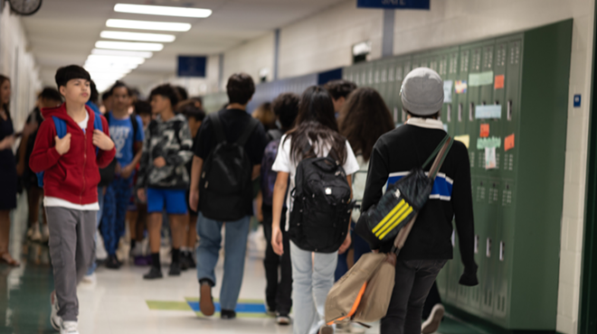 Students walk to class inside an NISD school.