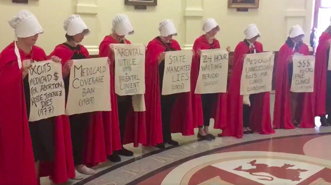 Women dressed like characters from The Handmaid's Tale protesting anti-abortion bills at the Texas state capitol.