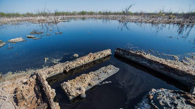 Brackish water flows from an unplugged abandoned well outside of Imperial in Pecos County. Texas reported more than 6,000 documented "orphan" oil wells in 2019, almost all on private land, but some experts believe that's an underestimate.