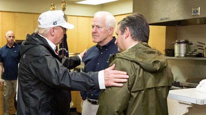 Donald Trump clasps the shoulders of Republican Senators from Texas John Cornyn (middle) and Ted Cruz (right).