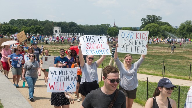 Teachers attend a protest march against the expansion of school vouchers.