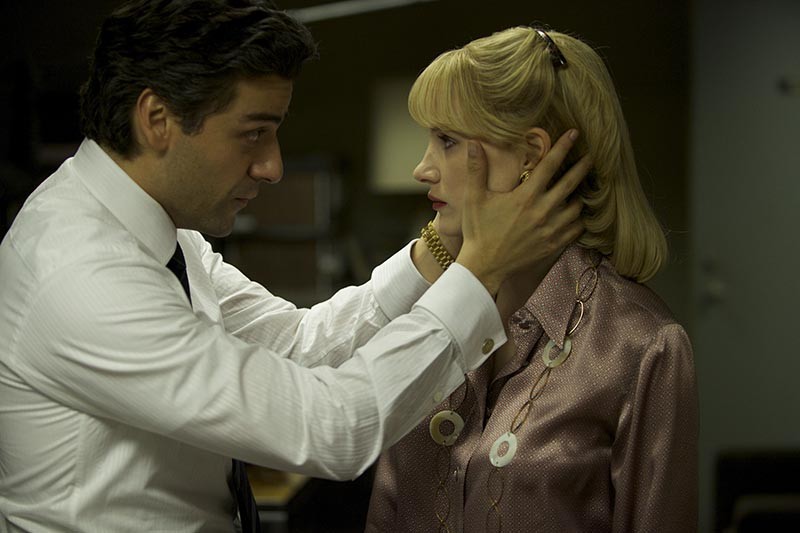 Oscar Isaac and Jessica Chastain have a staring contest in a tense moment from A Most Violent Year - COURTESY