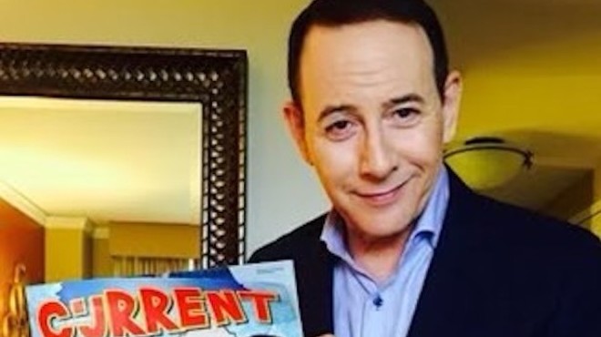 Paul Reubens poses with a Current cover story on the local love for Pee-Wee's Big Adventure in 2016.