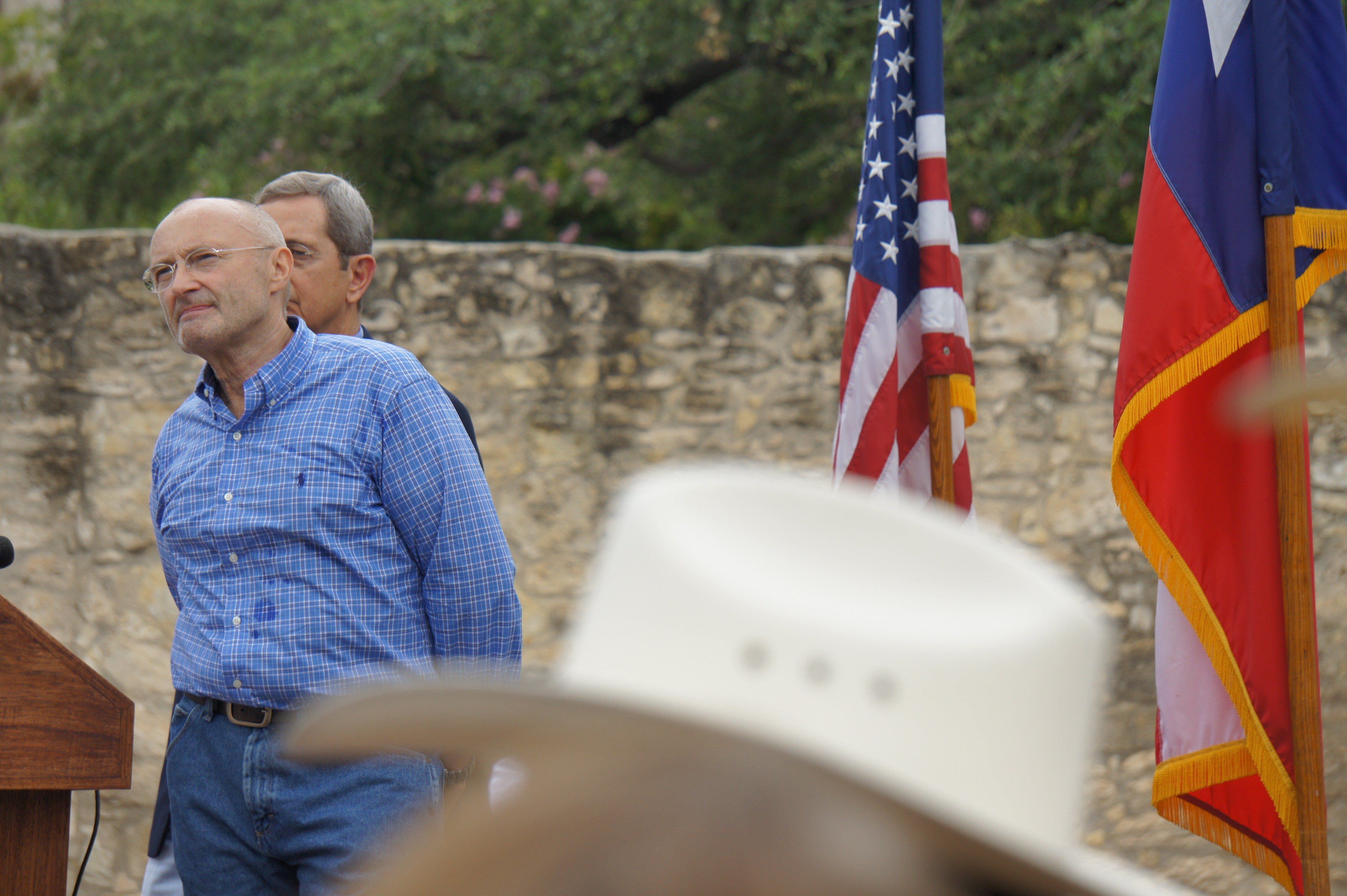 Former Genesis member and Alamo enthusiast Phil Collins is joined onstage by Texas Land Commissioner Jerry Patterson in front of the Alamo on June 26, 2014. Collins formally announced his intention to donate his entire private collection of Texas Revolution memorabilia to the state of Texas. - Albert Salazar