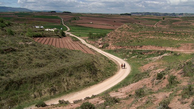 Pilgrims Misa and William walk a stretch of the Camino that passes through La Rioja in Spain - COURTESY