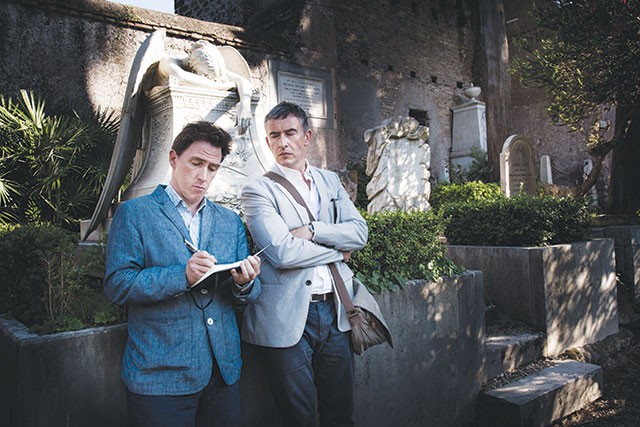 Rob Brydon, left, and Steve Coogan take a break from eating to hang out in a cemetery - COURTESY PHOTO