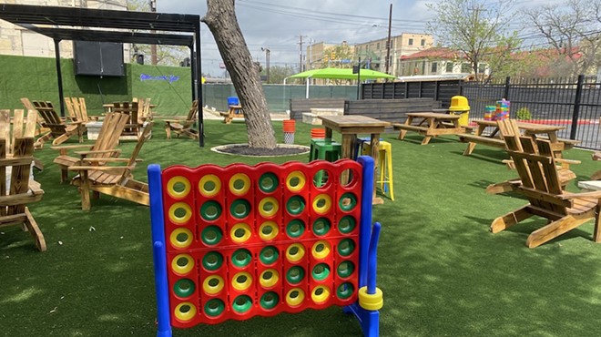 New patio bar Home Room features picnic tables and games such as this giant Connect 4.