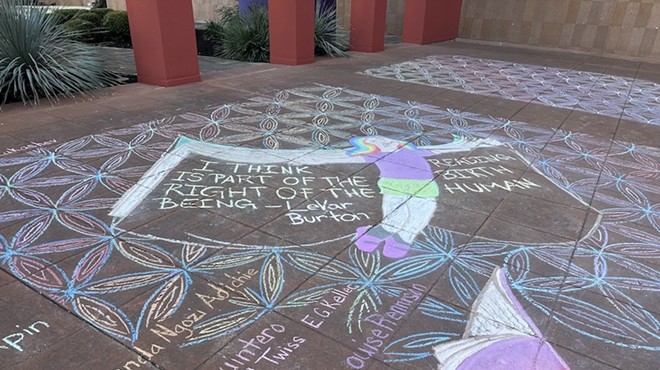 The anti-book banning chalk mural features a phrase by African American actor and director LeVar Burton that reads "I think reading is part of the birthright of the human being."