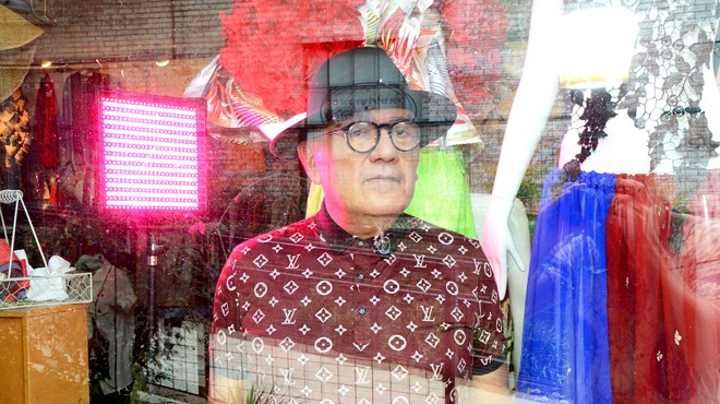 San Antonio designer Agosto Cuellar in the window of his Blue Star boutique Augustine.