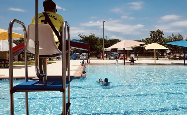 A lifeguard keeps watch at one of San Antonio's public pools.