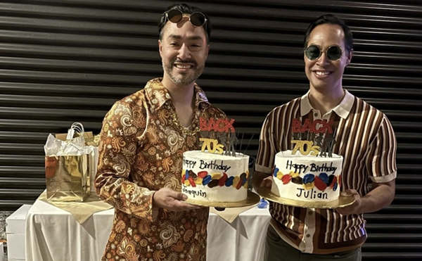 Congressman Joaquin Castro and former Obama cabinet member Julián Castro hold cakes celebrating their 50th birthdays.