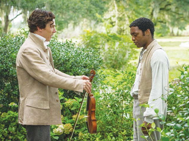 Shut up and play your violin—Plantation owner William Ford (Benedict Cumberbatch) and slave Solomon Northup (Chiwetel Ejiofor) - COURTESY PHOTOS