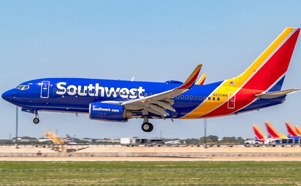 A Southwest Airlines 737-700 lands at an airport.