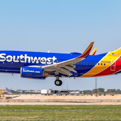 A Southwest Airlines 737-700 lands at an airport.