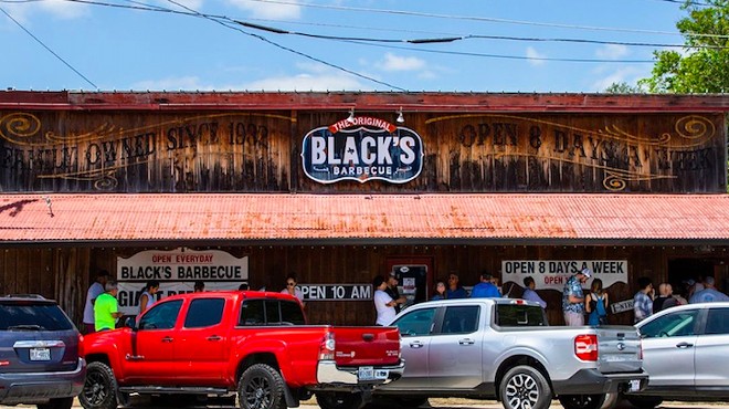 Customers line up outside the original Black's Barbecue in Lockhart.