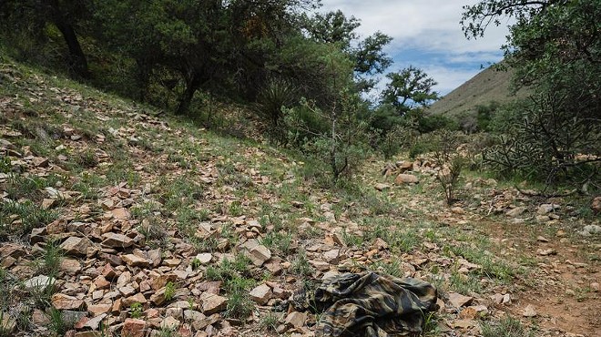 Clothing left behind along a trail frequented by migrants in Hudspeth County. The former warden of a private detention center and his brother have been arrested after a migrant was shot to death and another was wounded Tuesday in the county.