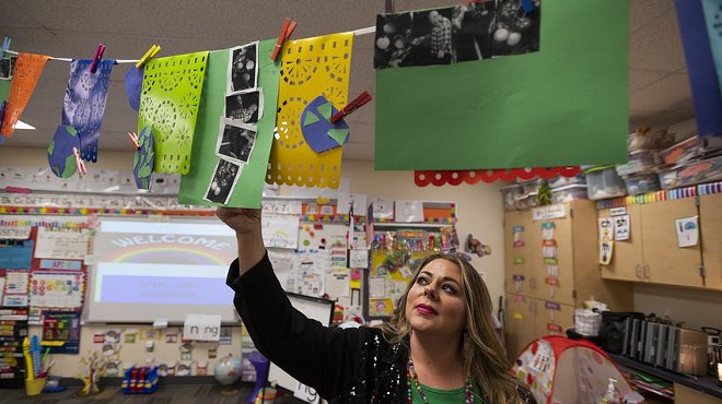 Chana Jones adjusts a decoration in her class room in Snyder Primary School. Jones is a kindergarten teacher at Snyder ISD, a district with less than 3,000 students about an hour and a half away from Midland.