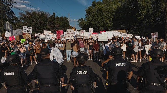 Police form a line to prevent protesters from walking down Third Street at a rally for abortion rights in Austin on June 26.