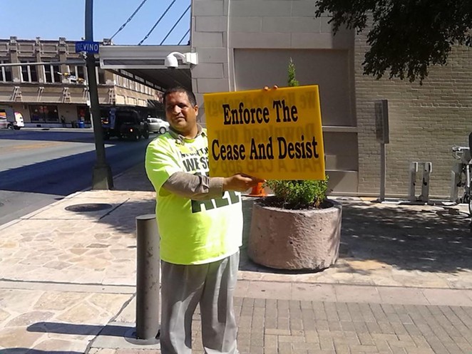 A taxi driver protests outside San Antonio's City Council chambers last year. The Alamo City passed strict ride-share regulations, prompting both Uber and Lyft to stop doing business in the city. - Mark Reagan