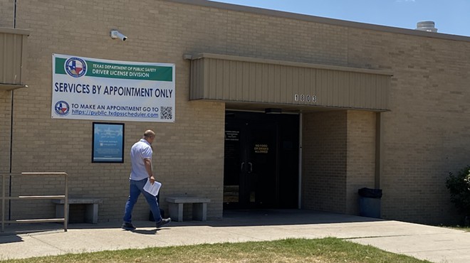 An individual walks into a DPS drivers license office in South San Antonio.