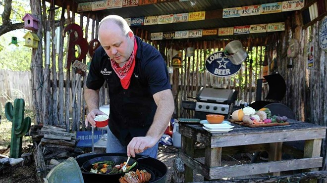 San Antonio barbecue aficionado and journalist Chuck Blount cooks up barbecue in his backyard.