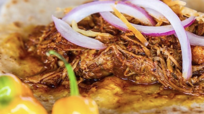 Tacos' Cochinita pibil with pickled onions are one of the menu items at Chela's.