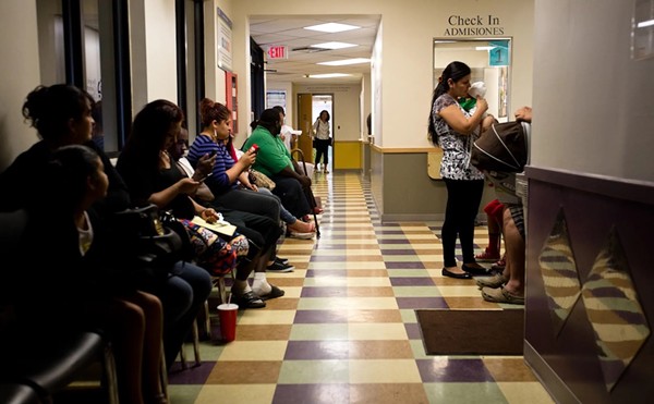 Patients wait to be seen at the People's Community Clinic in Austin, a federally qualified health center, which provides health services to low-income families and individuals.