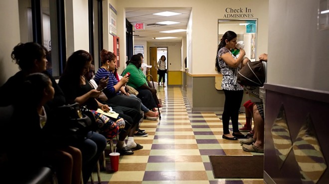 Patients wait to be seen at the People's Community Clinic in Austin, a federally qualified health center, which provides health services to low-income families and individuals.