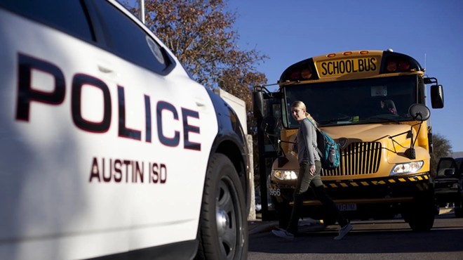 An Austin Independent School District police vehicle parked outside of McCallum High School in Austin, on Dec. 28, 2012.