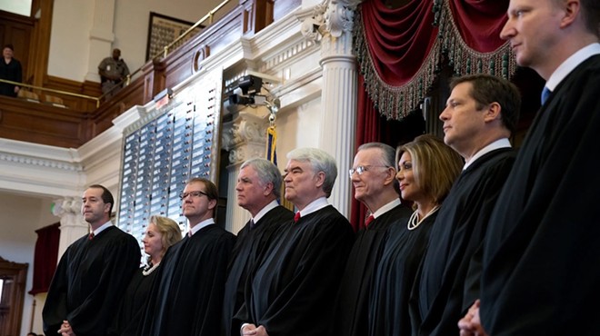 Texas Supreme Court Justice John Devine, far left, with fellow jurists on the state House floor in Austin in 2013.