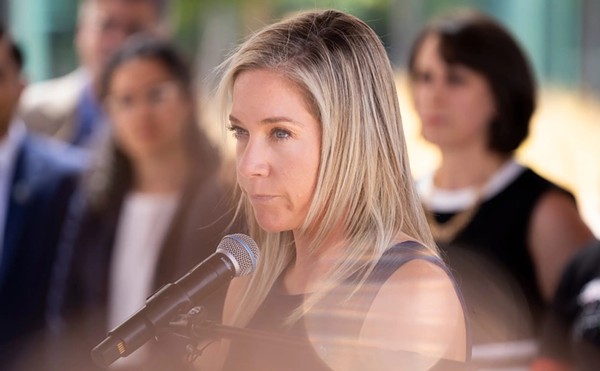 Amanda Zurawski, middle, addresses the press following the first day of testimony for Zurawski v. State of Texas outside the Travis County Civil and Family Courts Facility in Austin on July 19, 2023.