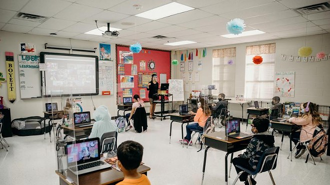 Plexiglass and 6 feet of space between each desk keep students socially distanced in Abigail Boyett’s third grade classroom.