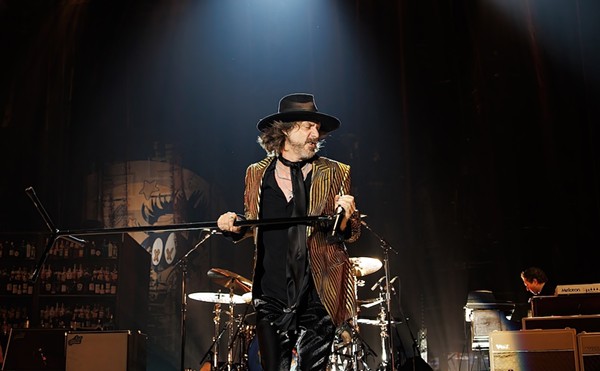 Chris Robinson, frontman of The Black Crowes, lets loose during a performance in Spain.