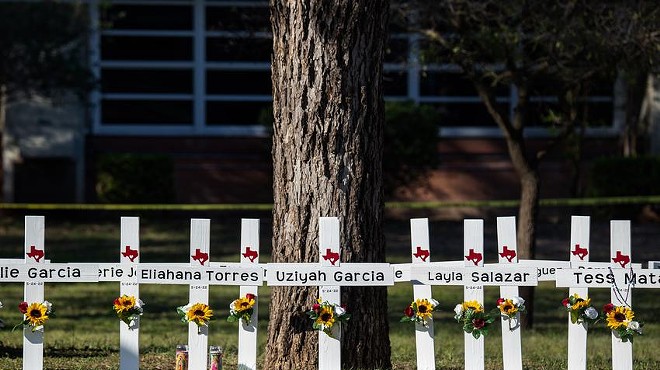 Crosses outside Robb Elementary School on Thursday bear the names of children killed at the school on Tuesday.