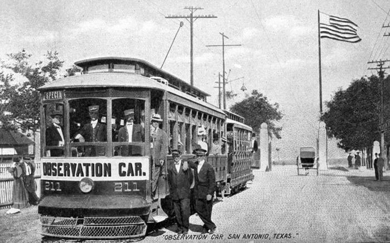 Streetcar outside entrance to Fort Sam Houston, 1909
Passengers and conductors standing in and outside streetcar on Grayson Street. Fort Sam Houston entrance is in the background.