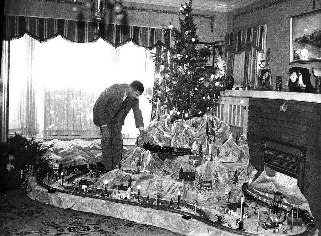 Dec 23, 1936 - 79 years ago today in the San Antonio Light. Photo shows A. G. Sherrer, 1235 Highland Blvd., with elaborate Christmas scene he constructed in his home for his son Jerry. Three electric trains and a complete station help make up this scene.(UTSA Special Collection)