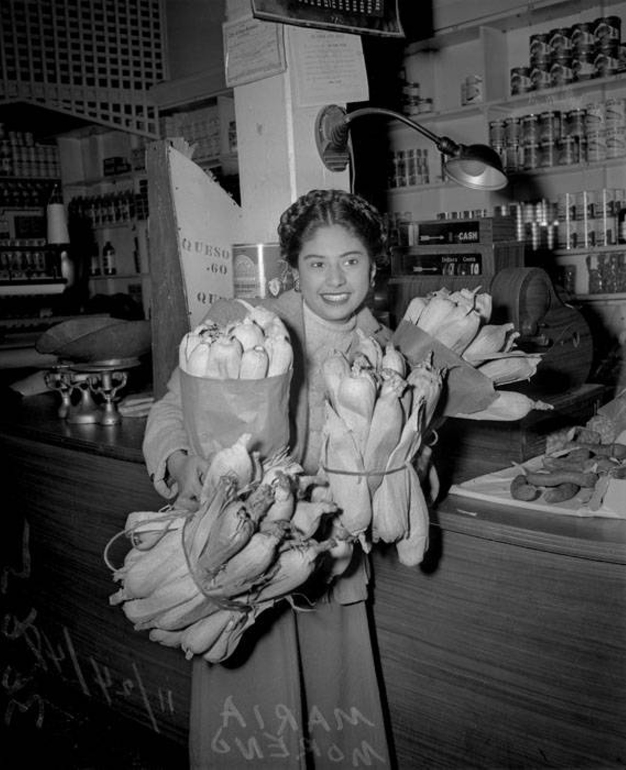 Maria Moreno was photographed carrying armloads of corn shucks by the San Antonio Light in 1948. No doubt preparing for an epic tamalada!