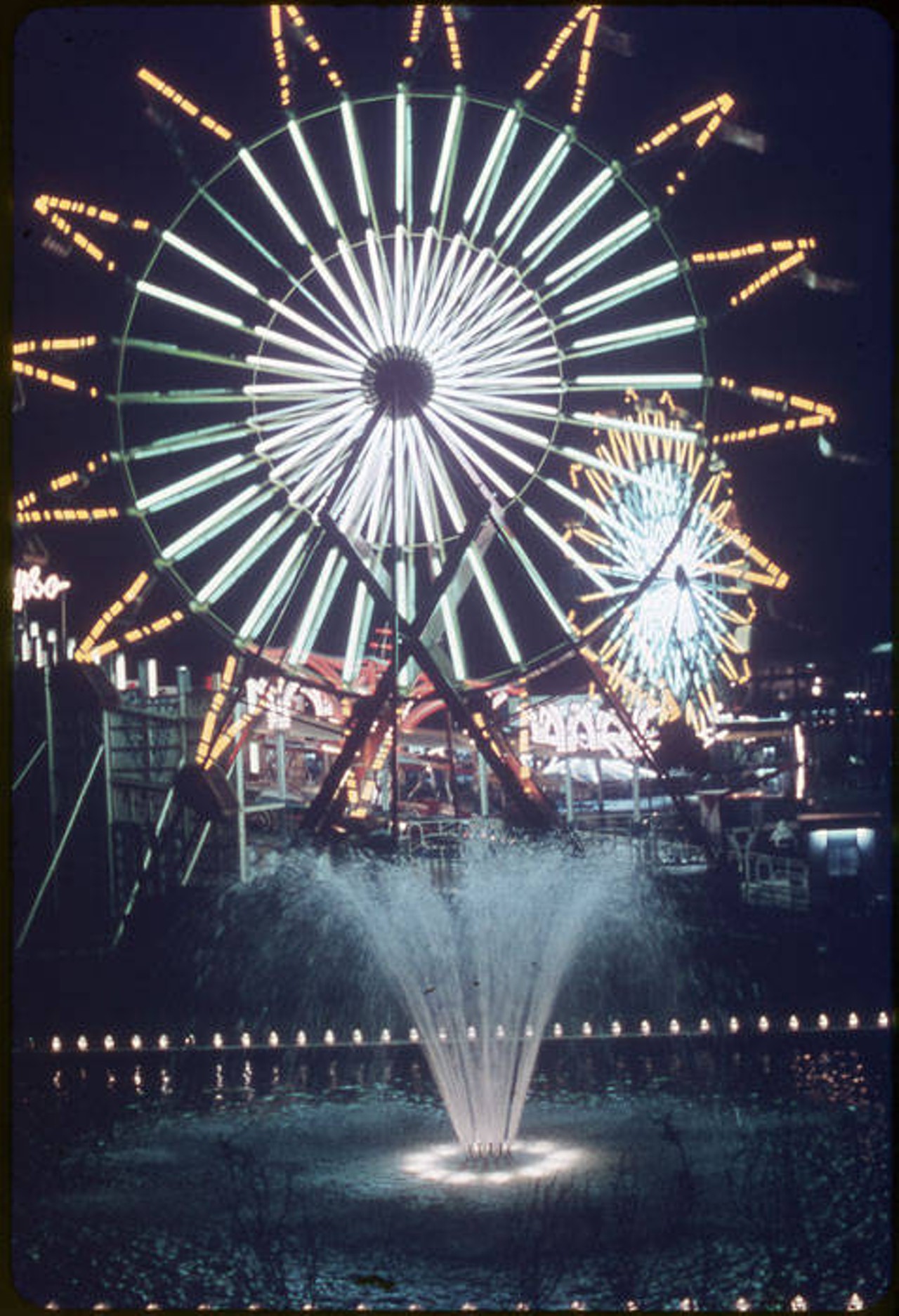 Fiesta Island, rides and games area at HemisFair'68, showing Ferris Wheel at night