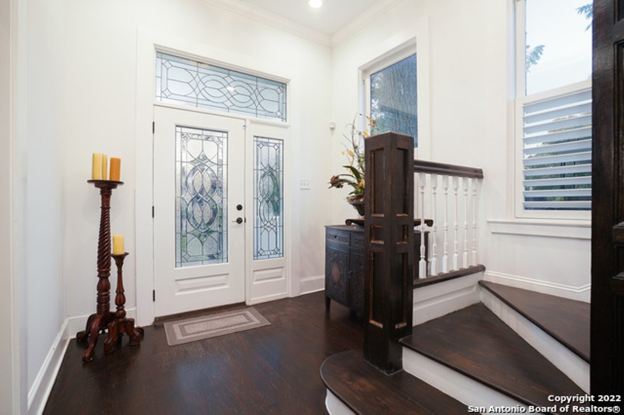 This 1930 San Antonio home for sale has two wraparound porches and a handcrafted fireplace mantel