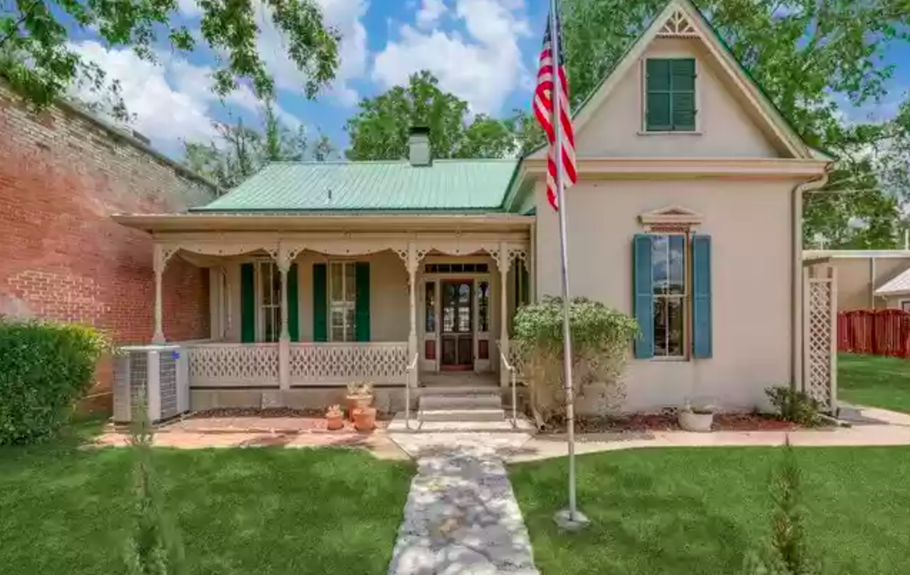 This historic San Antonio area-home comes with an 1830s log cabin on the property