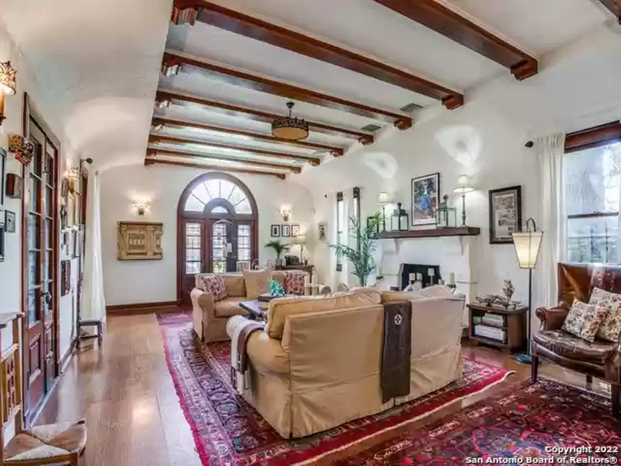 This historic Spanish-style near Woodlawn Lake has a domed mural and a spiral staircase