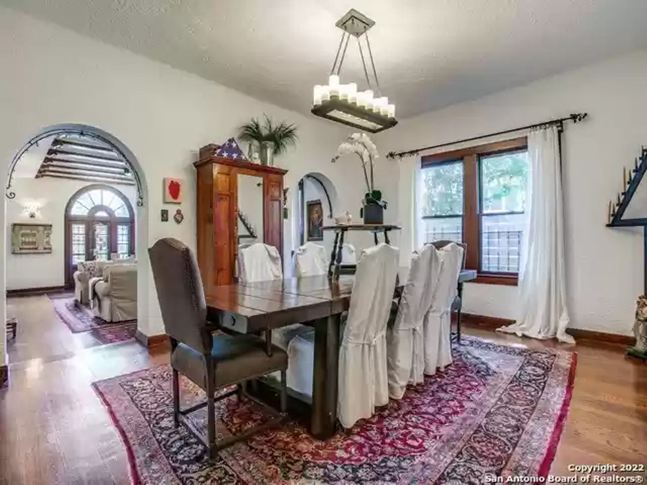 This historic Spanish-style near Woodlawn Lake has a domed mural and a spiral staircase