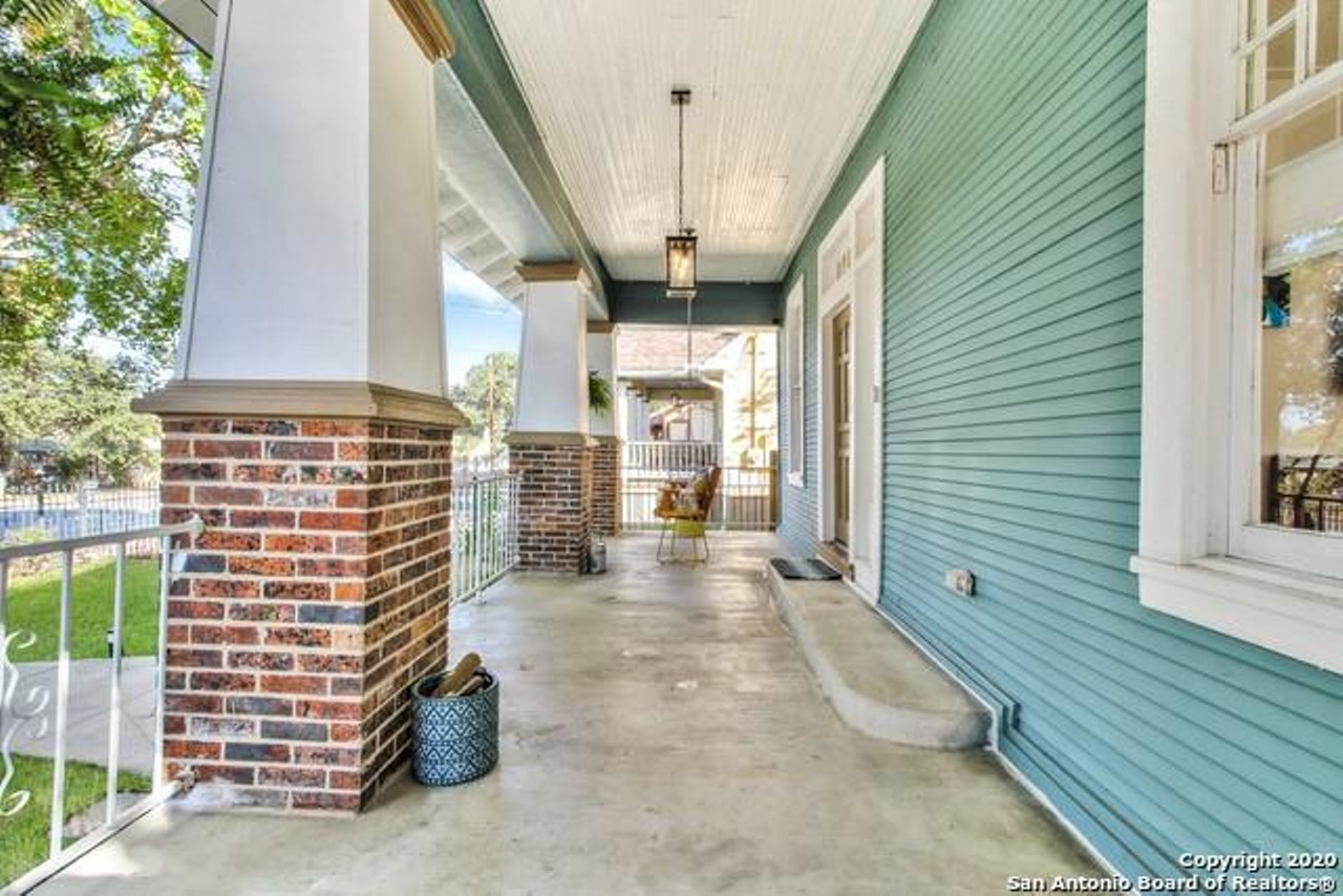 This restored 1930s home for sale in San Antonio has a front-porch view of Woodlawn Lake