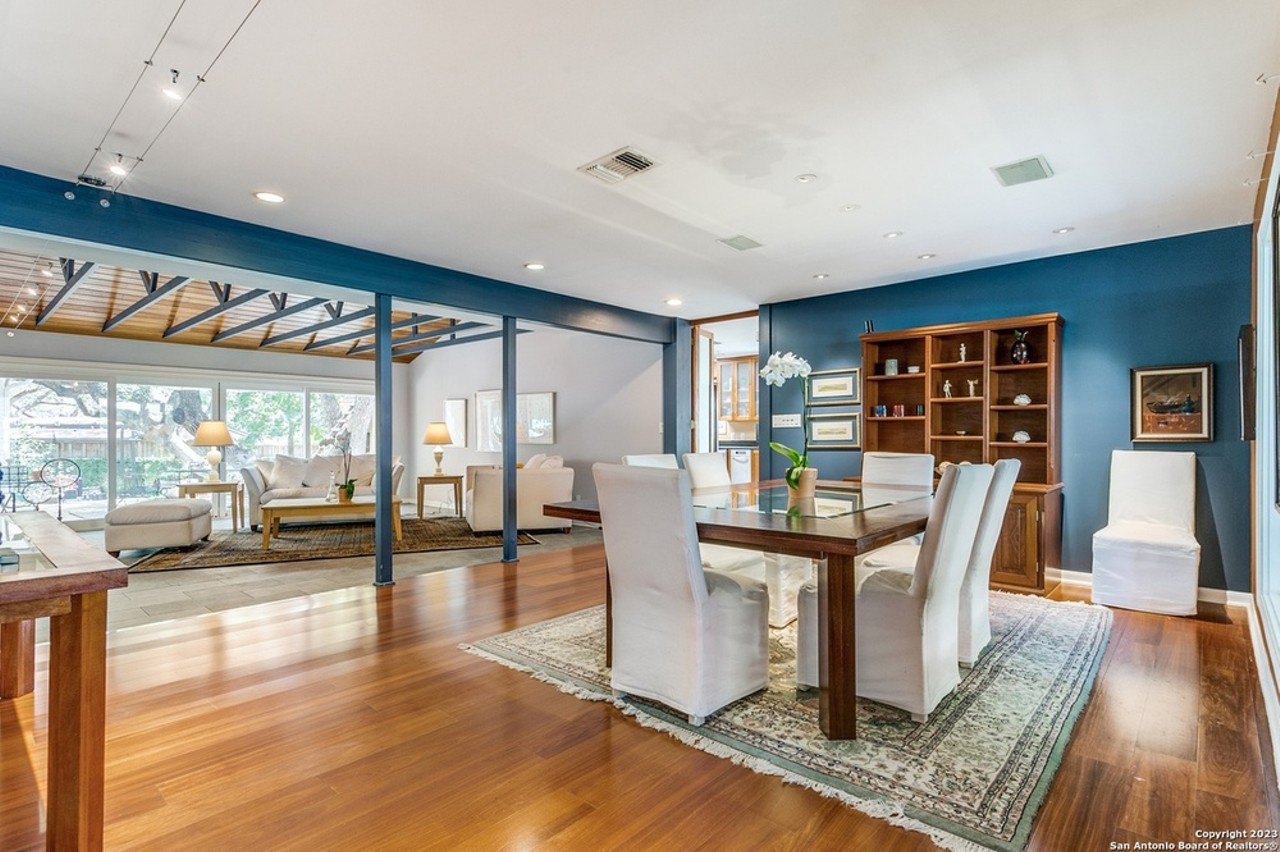 This San Antonio home comes with a two-story library featuring etched-glass mythic figures