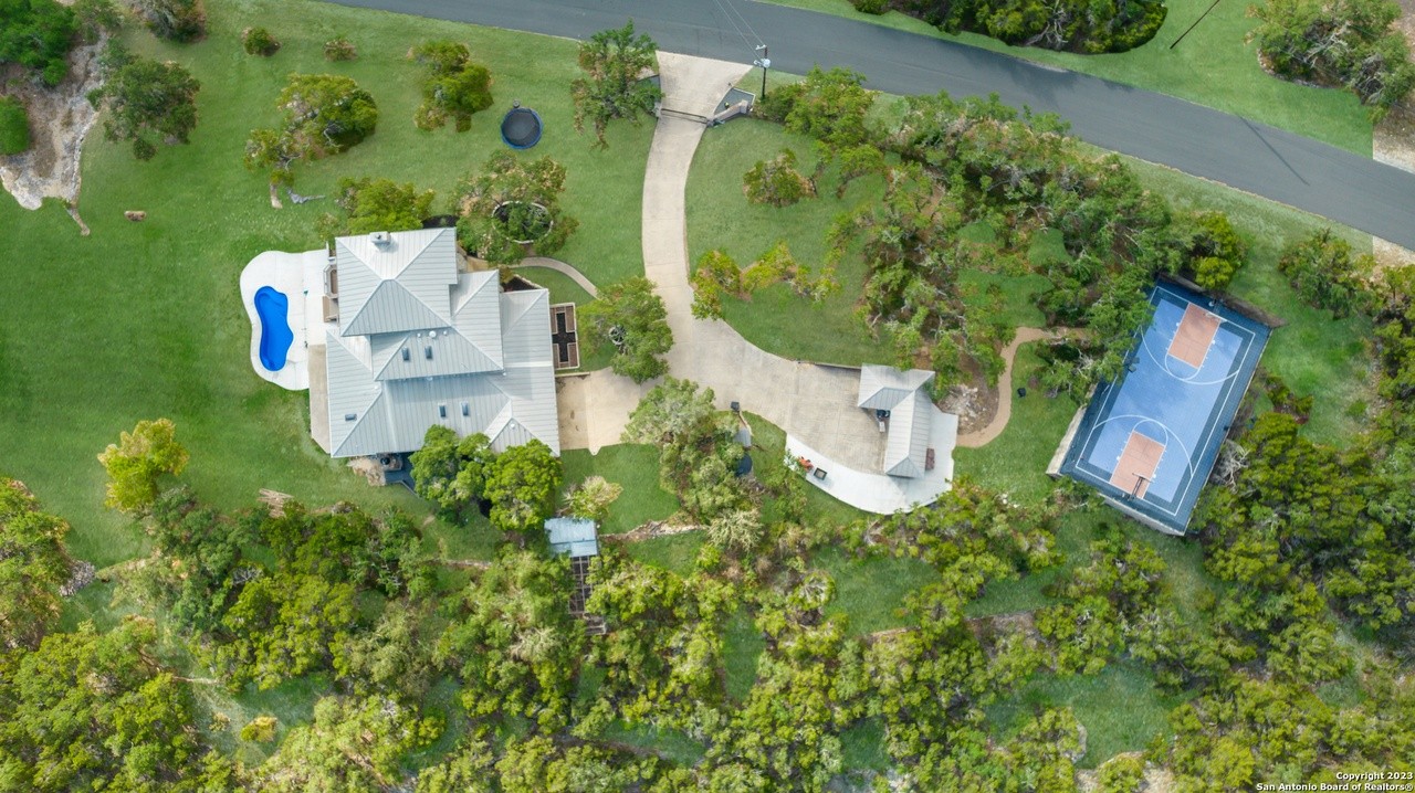 This San Antonio home for sale has a saltwater pool, a basketball court and a chicken coop