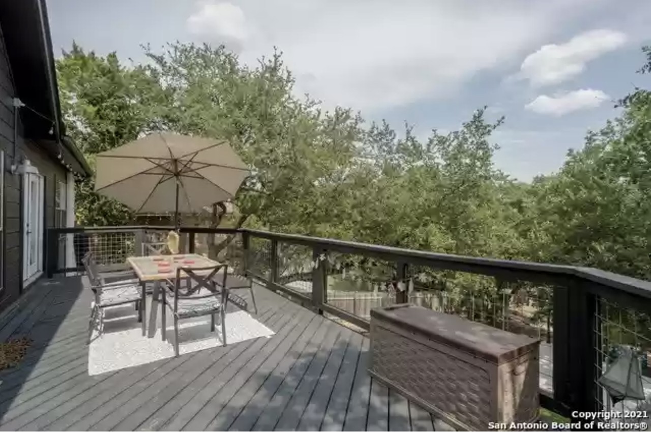 This San Antonio home for sale was built on a slope and has a bridge to reach the front door