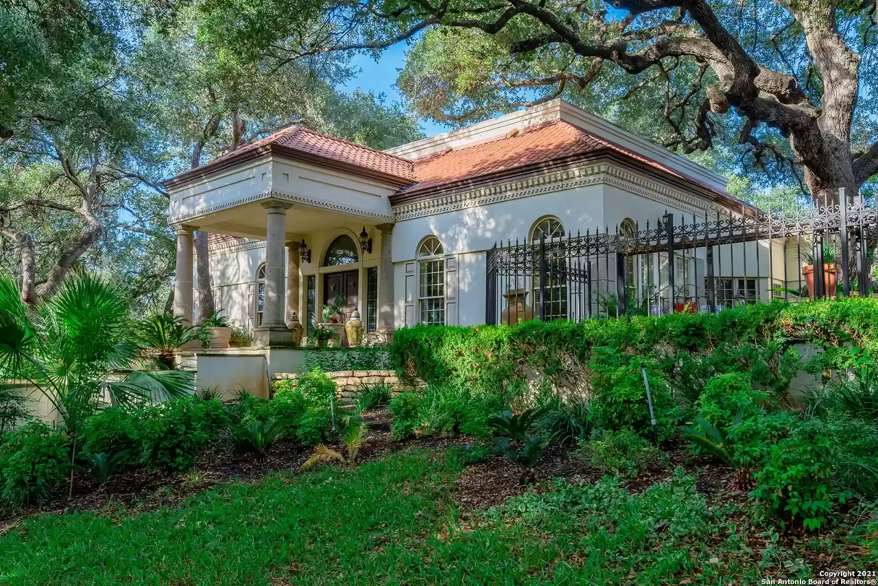 This San Antonio mansion for sale has copper animal sculptures in the backyard and a carousel bathroom