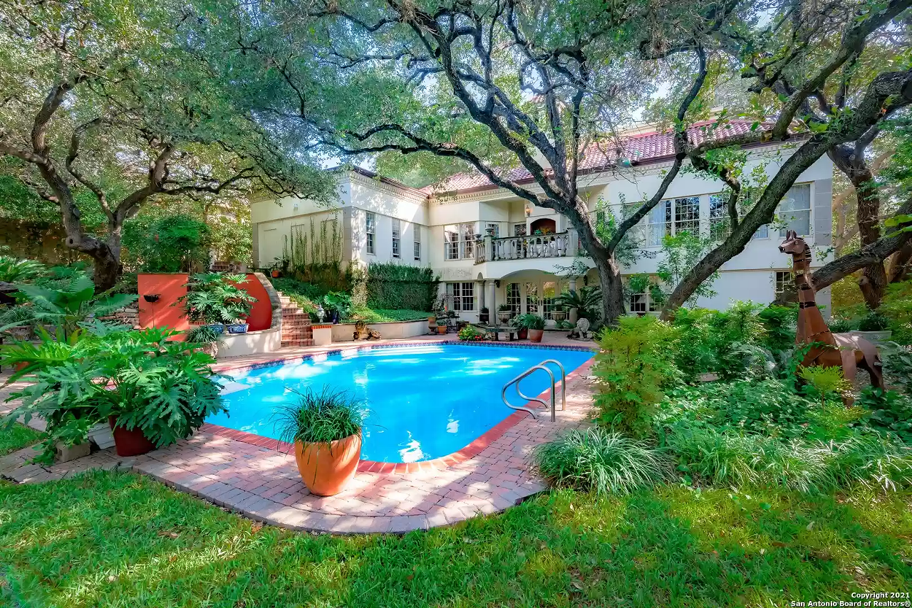 This San Antonio mansion for sale has copper animal sculptures in the backyard and a carousel bathroom