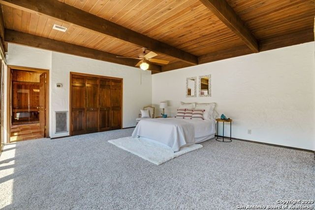 This Santa Fe-Style Home for Sale in San Antonio Has a Central Swimming Pool and Sauna