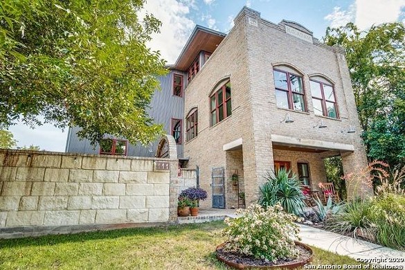 This three-story home near San Antonio includes pieces from an 1800s stable that once stood there